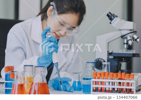 Portrait, science and happy woman on laptop in lab to research chemistry, test or innovation. Microscope, scientist and face of medical doctor in goggles for microbiology, healthcare or pharma study Portrait, science and happy woman on laptop in lab to research chemistry, test or innovation. Microscope, scientist and face of medical doctor in goggles for microbiology, healthcare or pharma study 134407066
