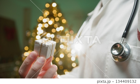 Private Anonymous Doctor Gives a Small Box to His Patients Under Treatment Private Anonymous Doctor Gives a Small Box to His Patients Under Treatment 134409132