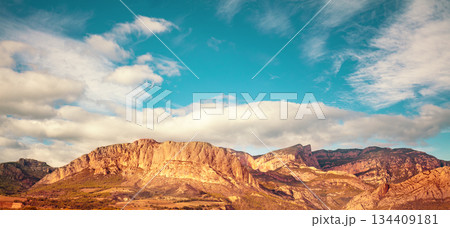 View of the mountain valley with the beautiful Mount Roc de Rombau. The Pyrenees Mountains. Peramola, Lleida, Spain. Horizontal banner 134409181