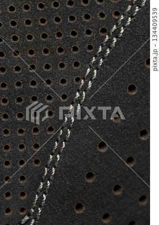 perforated natural leather of a dark shade for the manufacture of shoes, thick coarse leather used in leather shoes 134409539