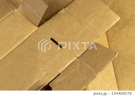 solid yellow cardboard for packaging products, a part of corrugated cardboard for packaging goods 134409578