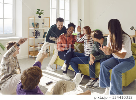 Young happy carefree people diverse group, graduate students, teens, college friends having fun Young happy carefree people diverse group, graduate students, teens, college friends having fun 134410312