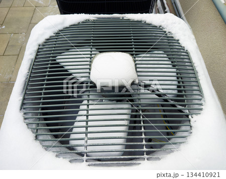 Outdoor HVAC units in winter snow 134410921