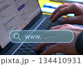 Hands typing laptop search bar 134410931