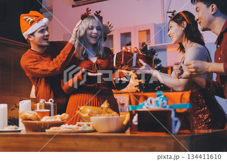 Festive Office Christmas Party with Delicious Food. A beautifully decorated office space with Christmas trees and festive lights, set up for a holiday party. Festive Office Christmas Party with Delicious Food. A beautifully decorated office space with Christmas trees and festive lights, set up for a holiday party. 134411610