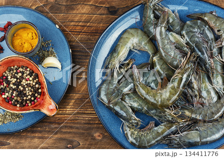 Seafood on a plate, pile of raw langoustines. Seafood on a plate, pile of raw langoustines. 134411776