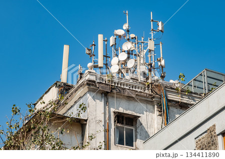 5G and 4G Mobile network directional antennas on the roof of residential building 5G and 4G Mobile network directional antennas on the roof of residential building 134411890