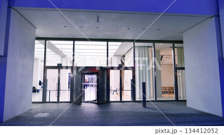 Warsaw, Poland. 4 November 2025. City life after dark. Museum of Modern Art with large glass fronts.. Dense corporate development in center city in the night.   134412052