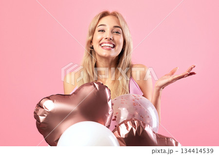 Beauiful young woman with colorful air balloons smiling, having birthday party, pink studio background. Joyful blonde model having fun and celebrating holiday. Festive concept Beauiful young woman with colorful air balloons smiling, having birthday party, pink studio background. Joyful blonde model having fun and celebrating holiday. Festive concept 134414539