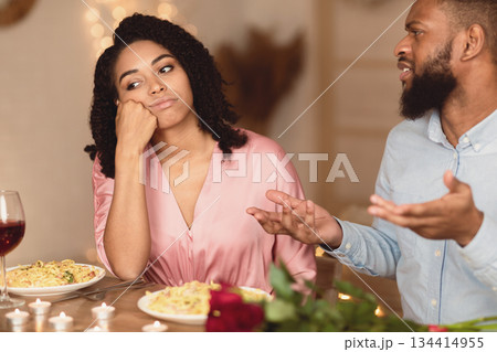 Family Conflict. Unhappy Sad African American Woman Sitting On Date In Restaurant, Having Unpleasant Conversation With Arguing Husband, Thinking About Breakup And Divorce. Relationship Problem Family Conflict. Unhappy Sad African American Woman Sitting On Date In Restaurant, Having Unpleasant Conversation With Arguing Husband, Thinking About Breakup And Divorce. Relationship Problem 134414955