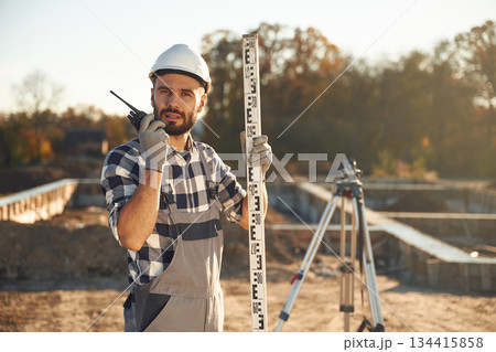 Worker is on the construction site at daytime 134415858