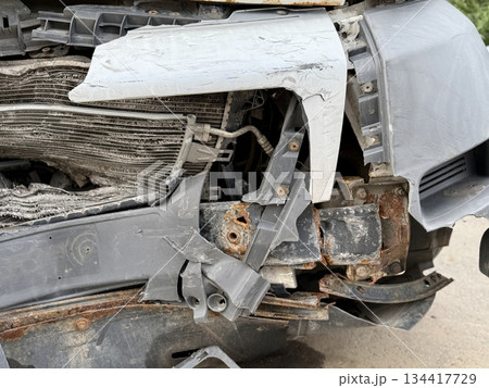 This minibus was significantly damaged as a result of a serious head-on collision. A seriously damaged grey minibus, which shows significant collision marks in the front and extensive rust marks. This minibus was significantly damaged as a result of a serious head-on collision. A seriously damaged grey minibus, which shows significant collision marks in the front and extensive rust marks. 134417729