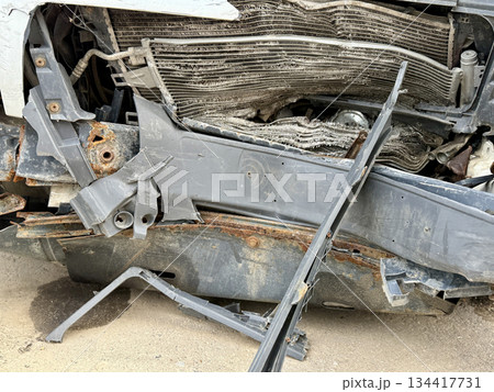 This minibus was significantly damaged as a result of a serious head-on collision. A seriously damaged grey minibus, which shows significant collision marks in the front and extensive rust marks. This minibus was significantly damaged as a result of a serious head-on collision. A seriously damaged grey minibus, which shows significant collision marks in the front and extensive rust marks. 134417731