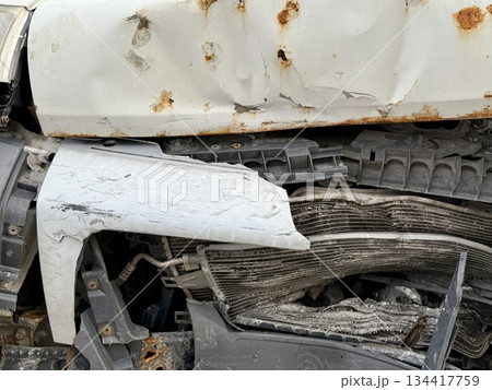 This minibus was significantly damaged as a result of a serious head-on collision. A seriously damaged grey minibus, which shows significant collision marks in the front and extensive rust marks. This minibus was significantly damaged as a result of a serious head-on collision. A seriously damaged grey minibus, which shows significant collision marks in the front and extensive rust marks. 134417759
