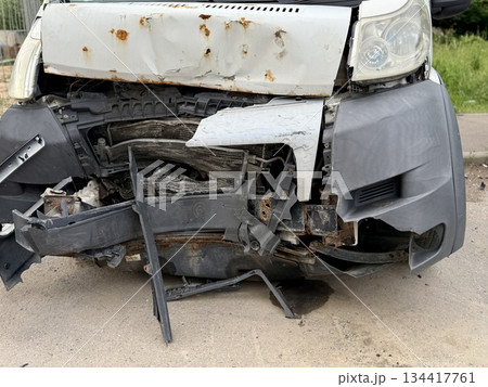This minibus was significantly damaged as a result of a serious head-on collision. A seriously damaged grey minibus, which shows significant collision marks in the front and extensive rust marks. This minibus was significantly damaged as a result of a serious head-on collision. A seriously damaged grey minibus, which shows significant collision marks in the front and extensive rust marks. 134417761