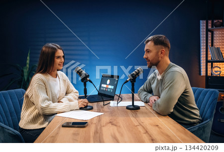 Having a conversation. Radio hosts recording podcast Having a conversation. Radio hosts recording podcast 134420209