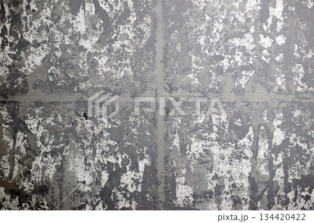 Detailed capture of a rough gray texture background with bold brush strokes and a superimposed cross Detailed capture of a rough gray texture background with bold brush strokes and a superimposed cross 134420422