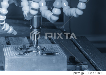 The CNC milling machine rough cutting the injection mold parts by indexable tools in the light blue scene. The CNC milling machine rough cutting the injection mold parts by indexable tools in the light blue scene. 134421899
