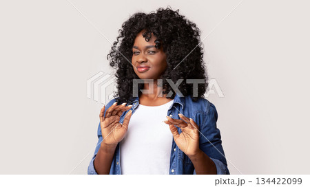 Portrait of black woman feeling unpleasant scent or showing disregard, african american lady suffering from stench, smelly sweaty person bring discomfort, looking at camera and raising hands 134422099