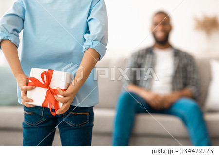 Father's Birthday. Son Preparing Surprise For Dad Holding Wrapped Gift Box Behind Back Congratulating Daddy On His B-Day At Home. Selective Focus On Present, Cropped. Family Holiday Concept. Rear View 134422225