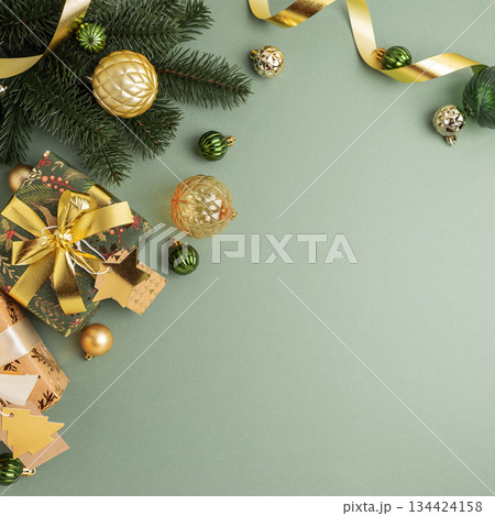Border fron Christmas Gifts with Ornaments and Evergreen Branches on Festive Background Border fron Christmas Gifts with Ornaments and Evergreen Branches on Festive Background 134424158