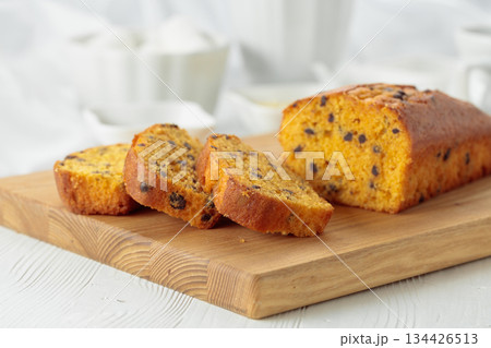 Cake with chocolate pieces on a cutting board. Cake with chocolate pieces on a cutting board. 134426513