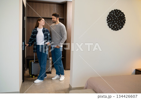 Caucasian couple entering their room in the hotel 134426607