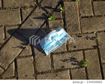 surgical mask on the ground 134426802