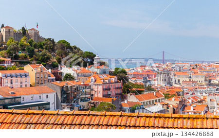 Vibrant Lisbon panorama featuring terracotta rooftops, colorful houses. Portugal Vibrant Lisbon panorama featuring terracotta rooftops, colorful houses. Portugal 134426888