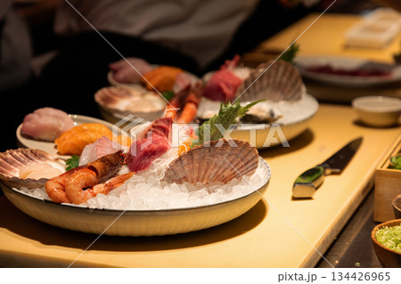 Fresh seafood platter with assorted sushi and shellfish on ice display 134426965