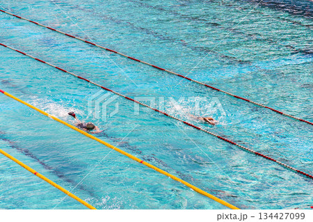 Unrecognizable people swimming in beautiful outdoors public pool, Podoli swimming complex, Prague, Czech republic Unrecognizable people swimming in beautiful outdoors public pool, Podoli swimming complex, Prague, Czech republic 134427099