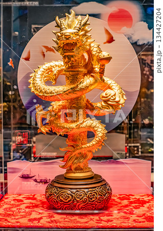 Golden dragon sculpture with intricate details and vibrant colors Golden dragon sculpture with intricate details and vibrant colors 134427204