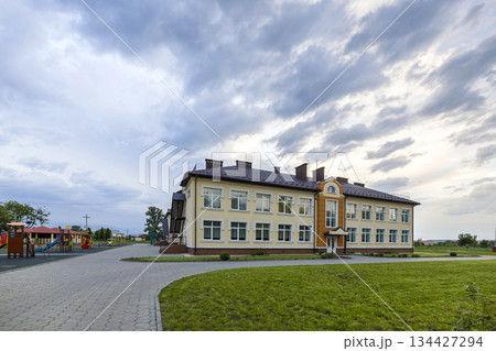 Kindergarten preschool building with big windows. Architecture and development concept. 134427294