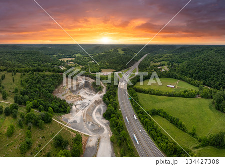 Industrial open-pit mining site with limestone quarry at mountain hillside 134427308