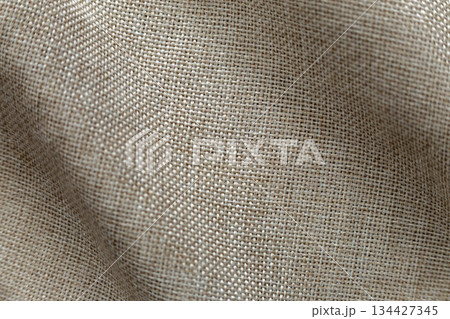 Gray beige linen canvas surface background. Sackcloth design, ecological cotton textile, fashionable woven flex burlap. Gray beige linen canvas surface background. Sackcloth design, ecological cotton textile, fashionable woven flex burlap. 134427345