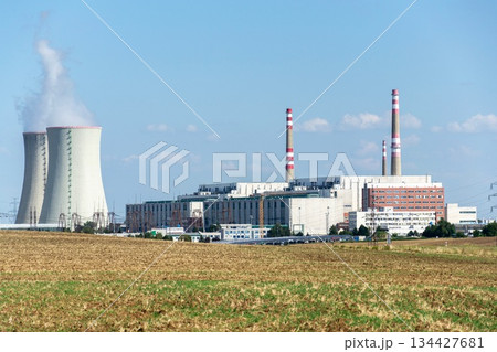 Cooling towers at nuclear power plant, energy self-sufficiency, greenhouse emission reduction and global warming concept 134427681