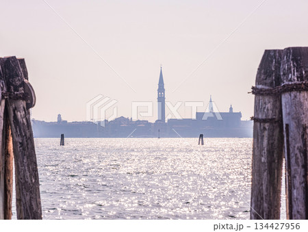 view Murano island in north lagoon and glassware factories on Venice. view Murano island in north lagoon and glassware factories on Venice. 134427956
