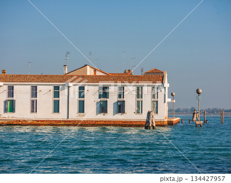 view Murano island in north lagoon and glassware factories on Venice. 134427957