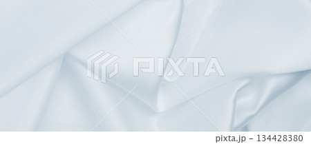 Smooth elegant grey silk or satin luxury cloth as wedding background. Luxurious background design Smooth elegant grey silk or satin luxury cloth as wedding background. Luxurious background design 134428380