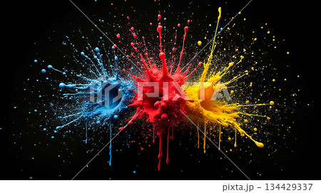 Vibrant splashes of blue, red, and yellow paint create a dynamic abstract display on a black background 134429337