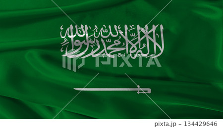 Flag of Saudi Arabia with fabric textured background. Close up of National flag of Saudi Arabia with realistic texture 134429646