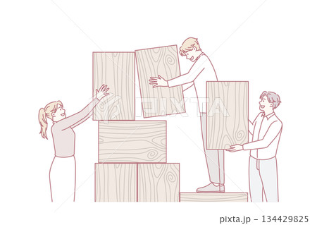 Businesspeople build wooden tower involved in teamwork 134429825