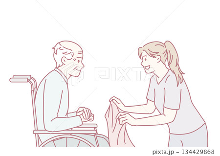 Attentive caregiver take care of mature patient in wheelchair 134429868