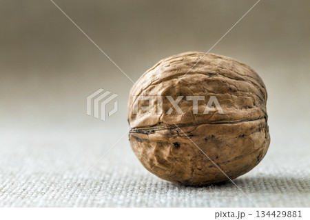 Close-up of walnut in wooden shell isolated on light copy space background. Healthy tasty organic food concept. 134429881