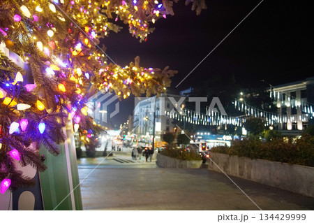 Christmas lights background (Christmas tree) - blur - night view - traces of headlights and taillights of cars of Rustaveli Avenue in Tbilisi Christmas lights background (Christmas tree) - blur - night view - traces of headlights and taillights of cars of Rustaveli Avenue in Tbilisi 134429999