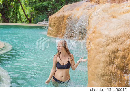 Female tourist exploring Grutas Tolantongo in Mexico, enjoying natural hot springs, scenic caves, and outdoor adventure. Travel, wellness, and sightseeing concept Female tourist exploring Grutas Tolantongo in Mexico, enjoying natural hot springs, scenic caves, and outdoor adventure. Travel, wellness, and sightseeing concept 134430015