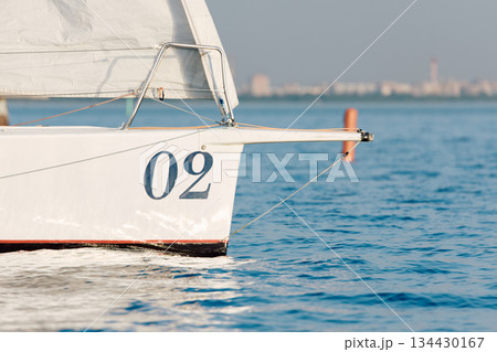 bow of a sailing boat with bowsprit at sailing regatta in the Gulf of Finland at sunny day, sailing yacht competing in a race, splashing water from under the boat, teamwork, board the boat 134430167