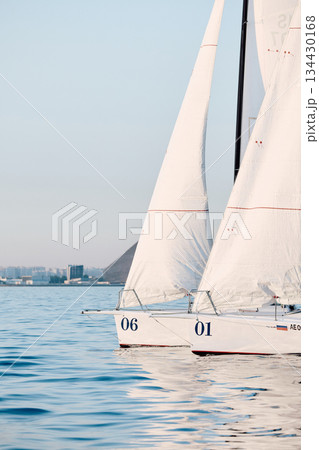 bow of a sailing boats with bowsprit at sailing regatta in the Gulf of Finland at sunny day, sailing yacht competing in a race, splashing water from under the boat, teamwork, board the boat 134430168