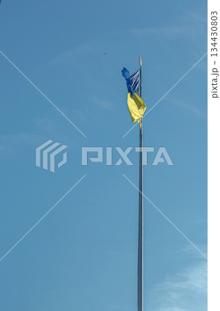 Ukrainian flag against the blue sky Ukrainian flag against the blue sky 134430803
