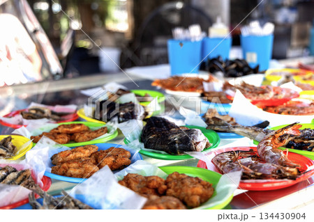 Mediterranean seafood street food platter with fish, shrimp, and crabs. 134430904